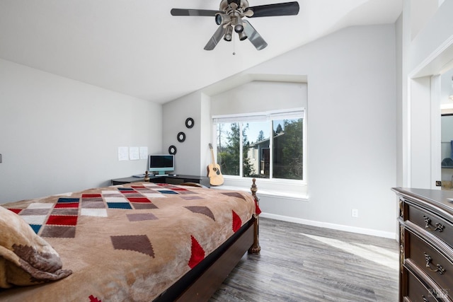 bedroom with vaulted ceiling, dark hardwood / wood-style floors, and ceiling fan