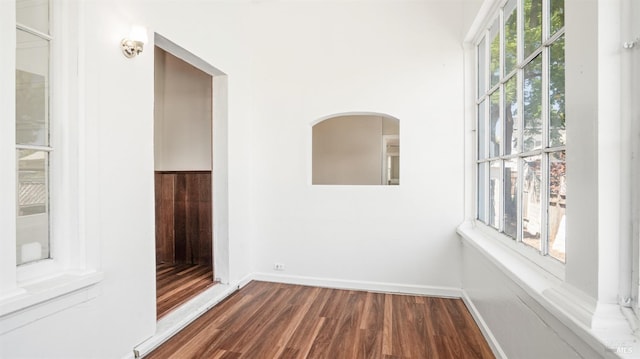 unfurnished room featuring dark hardwood / wood-style floors