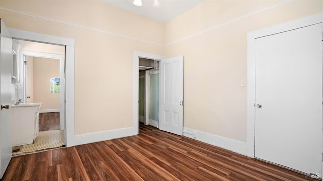 unfurnished bedroom featuring dark hardwood / wood-style floors