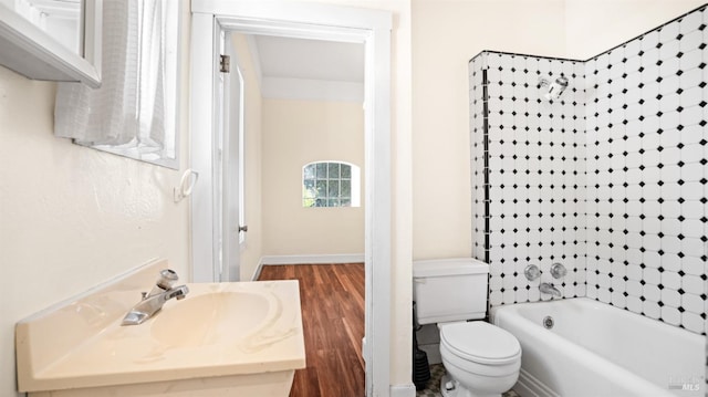 full bathroom with vanity, hardwood / wood-style floors, toilet, and shower / bath combination