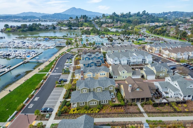 birds eye view of property with a residential view and a water and mountain view