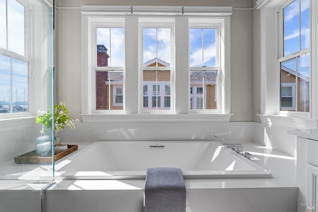 full bath with a tub to relax in