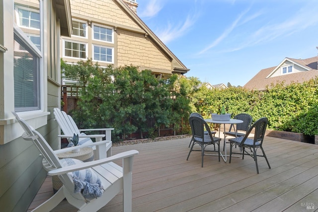 deck featuring outdoor dining area