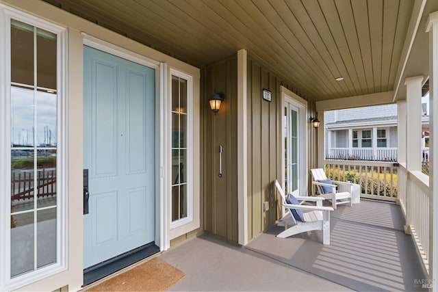 property entrance featuring a porch