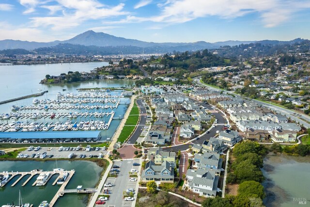 drone / aerial view with a water and mountain view