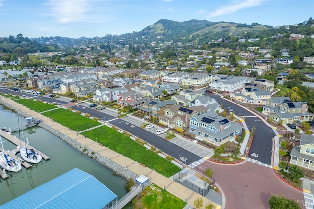 birds eye view of property with a residential view and a water and mountain view