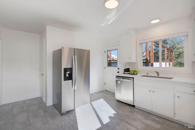 kitchen with white cabinetry, appliances with stainless steel finishes, and sink