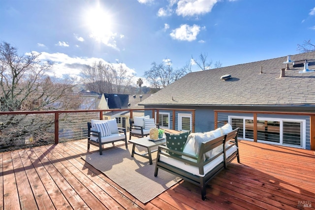 wooden deck with an outdoor hangout area