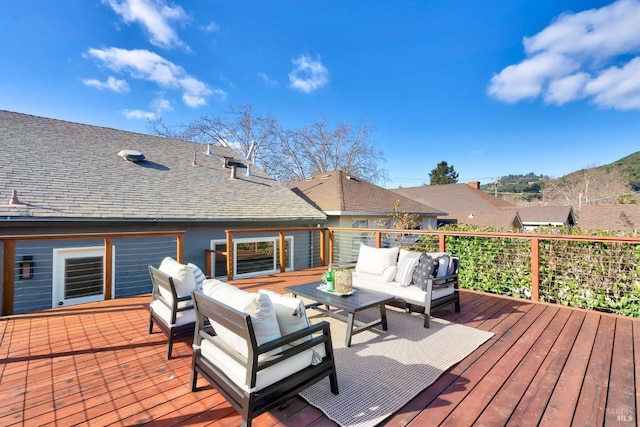 wooden deck featuring outdoor lounge area