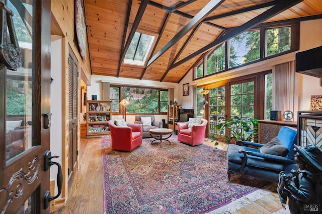 living room with high vaulted ceiling, french doors, and wooden ceiling