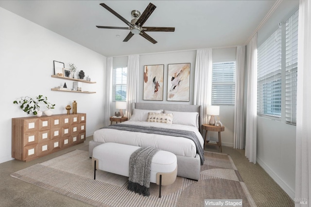 bedroom featuring light carpet and ceiling fan