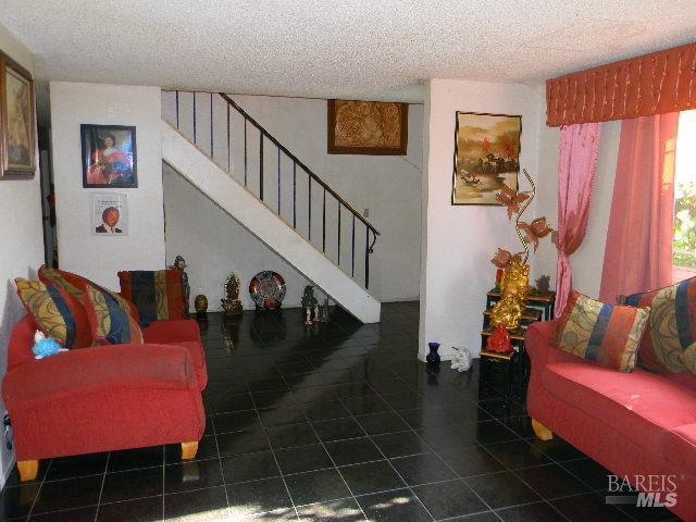 living room featuring a textured ceiling