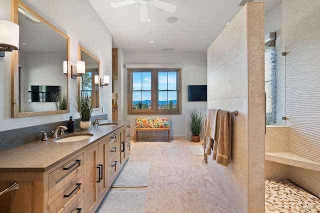 bathroom featuring ceiling fan and vanity