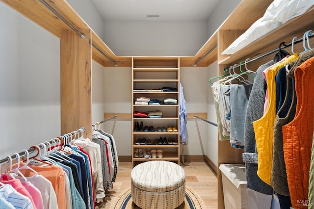 spacious closet featuring light hardwood / wood-style flooring