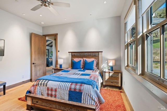 bedroom featuring ceiling fan and hardwood / wood-style floors