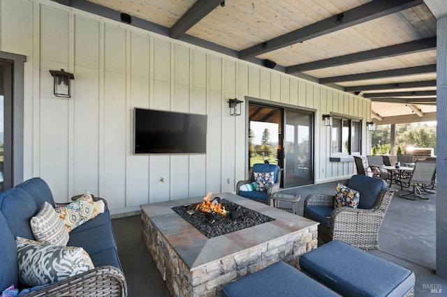 view of patio with a fire pit