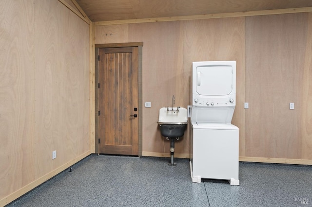 washroom with stacked washer and dryer