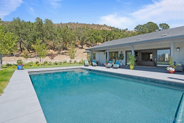 view of swimming pool with a patio