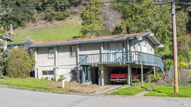 view of front of house featuring a wooden deck