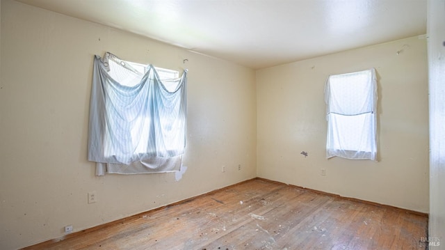 empty room featuring hardwood / wood-style flooring