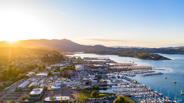 aerial view at dusk with a water and mountain view