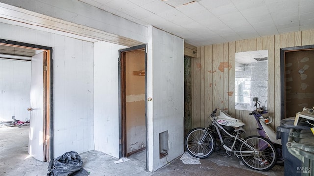 miscellaneous room with wooden walls