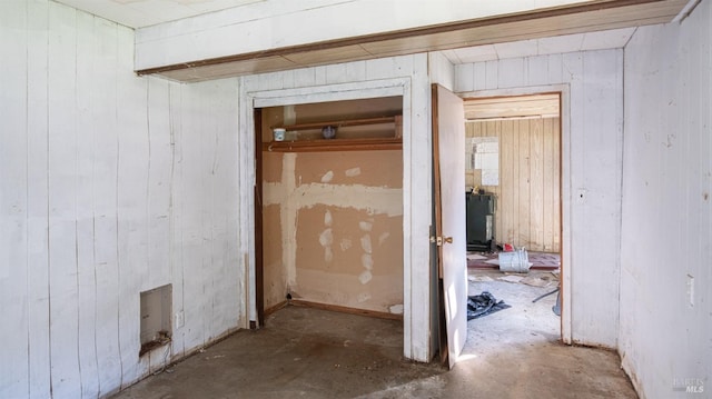 hall featuring concrete flooring