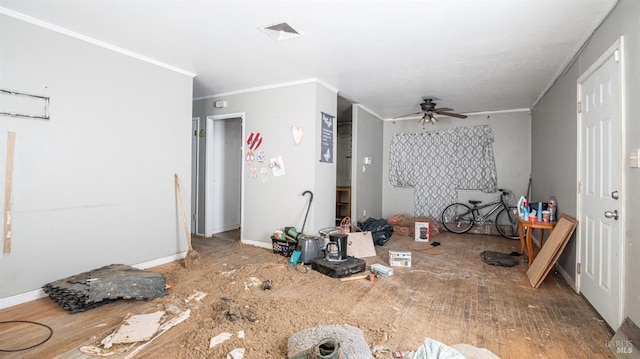 living room featuring crown molding and ceiling fan