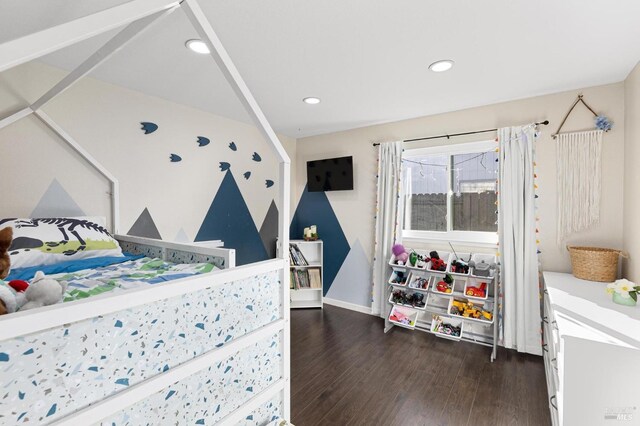 bedroom with dark wood-type flooring