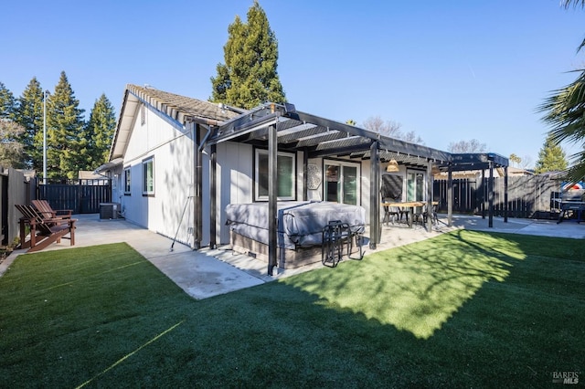 back of property with cooling unit, a yard, a pergola, and a patio area