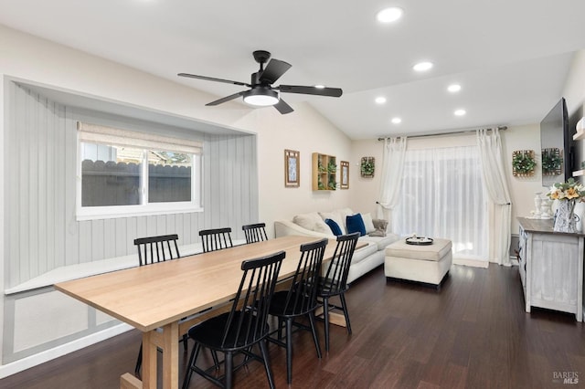 dining area featuring dark hardwood / wood-style flooring, lofted ceiling, and ceiling fan