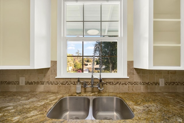 details with light stone countertops and sink