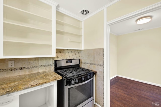 kitchen featuring backsplash, ornamental molding, light stone counters, gas range, and dark wood-type flooring