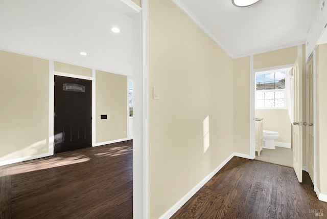 corridor featuring dark hardwood / wood-style flooring