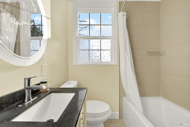 full bathroom with vanity, shower / tub combo, tile patterned floors, and toilet