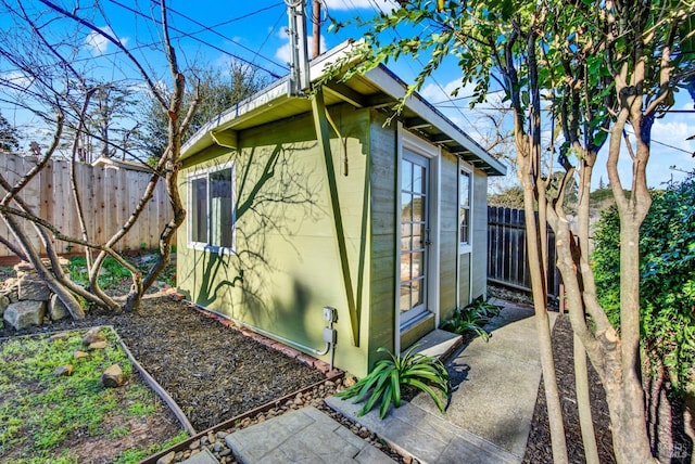 view of side of home with an outbuilding