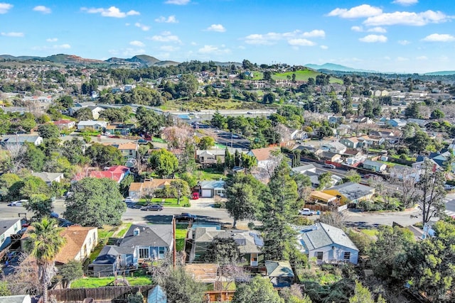 birds eye view of property with a mountain view