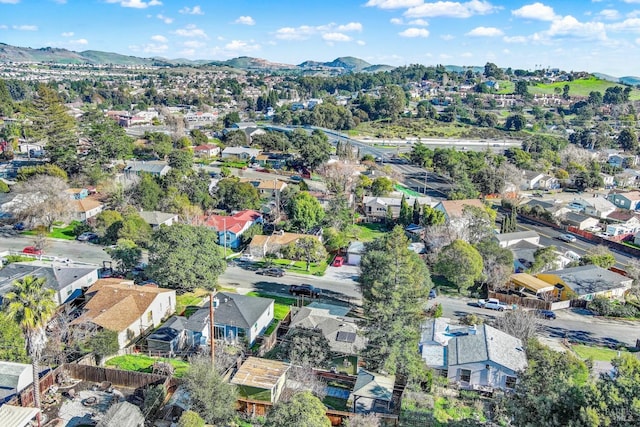 birds eye view of property featuring a mountain view