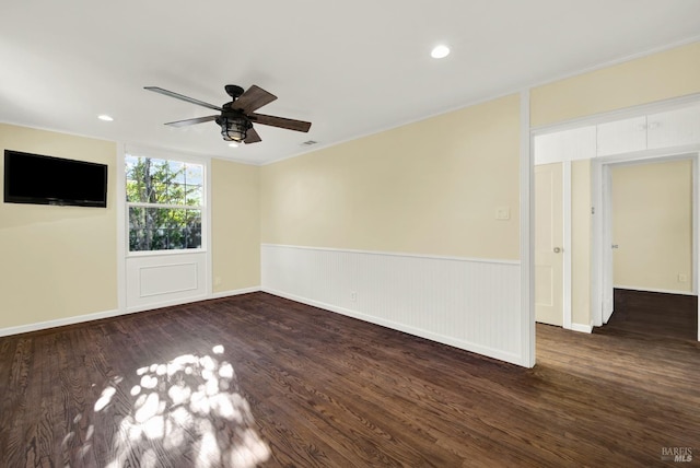 unfurnished room with dark hardwood / wood-style flooring and ceiling fan