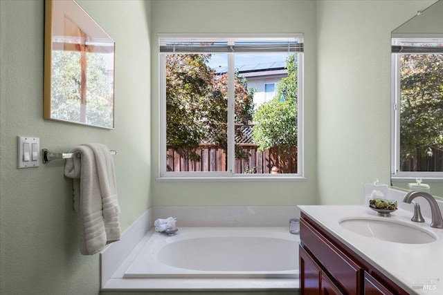 bathroom with vanity and a bathtub