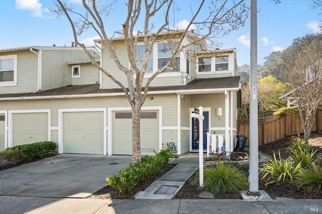 townhome / multi-family property featuring a garage