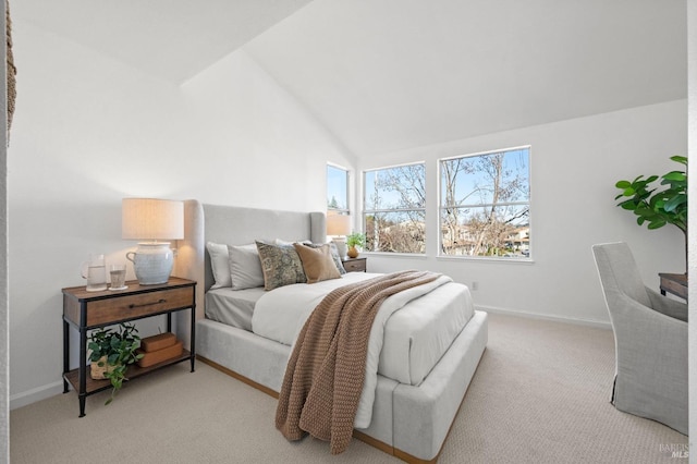 bedroom with light carpet and lofted ceiling