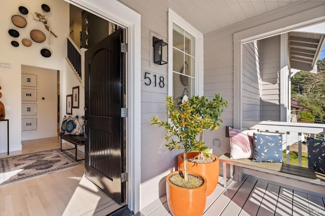 view of exterior entry with covered porch