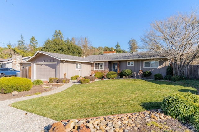 ranch-style home with a garage, fence, a chimney, board and batten siding, and a front yard