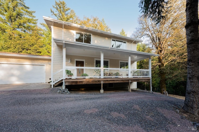 view of front of home with a porch and driveway
