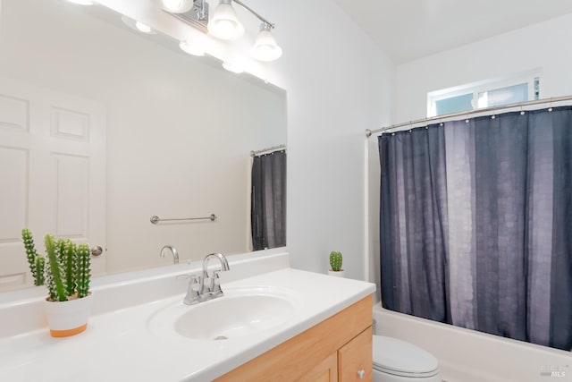 full bathroom featuring shower / bath combination with curtain, vanity, and toilet