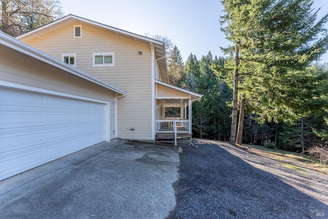 view of front of house with a porch and a garage