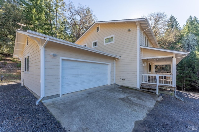 view of home's exterior featuring driveway and a garage