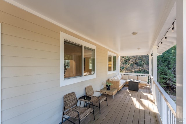 wooden deck featuring an outdoor living space