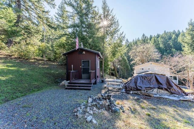 view of shed featuring a forest view